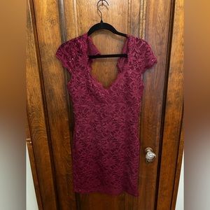 Purplish-red lace dress with sequins and short sleeves.